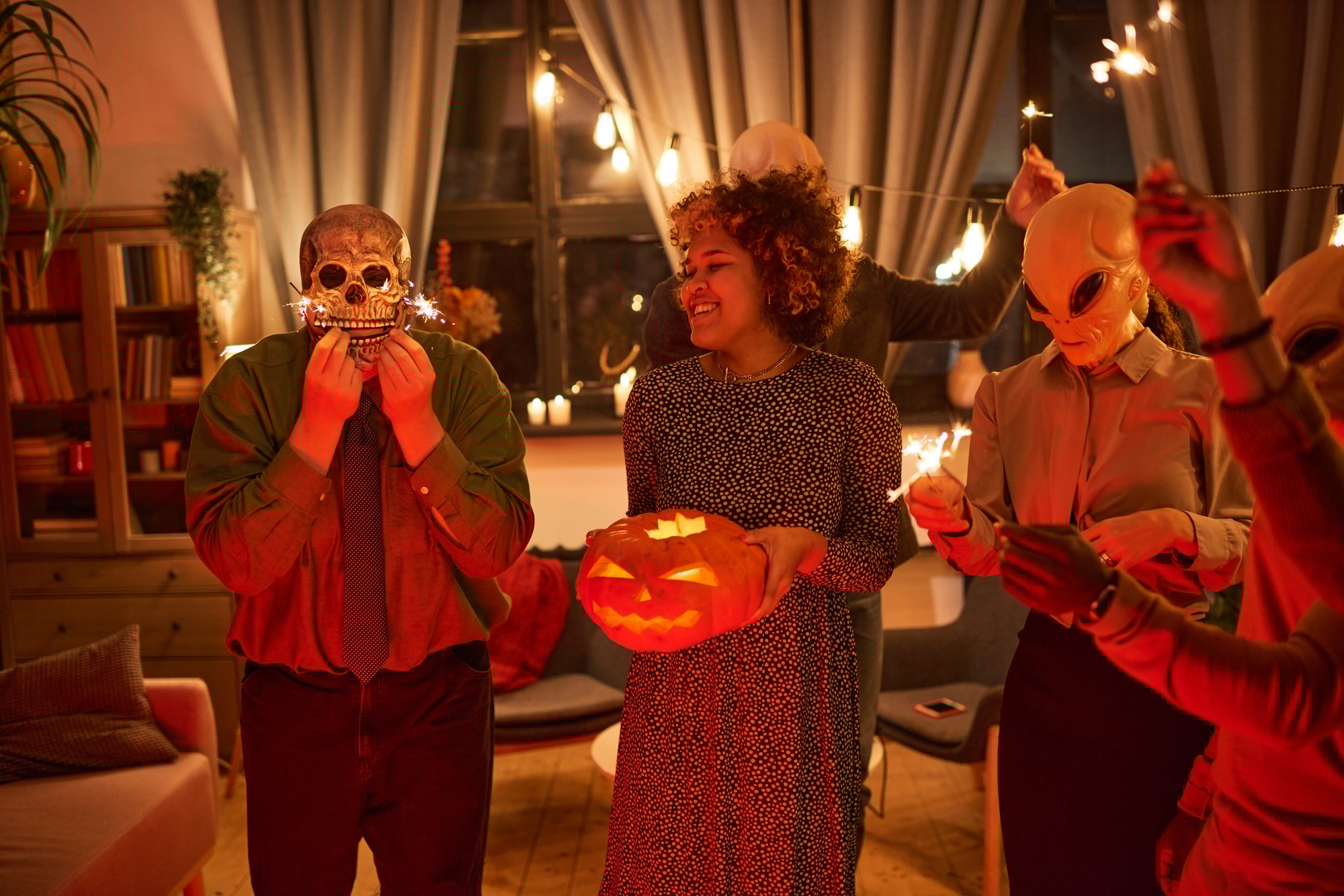 Friends celebrating Halloween with pumpkin